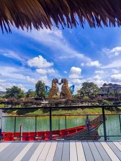 SeaVerse lake, red boat and sculptures pictured in the Hat Yai brochure